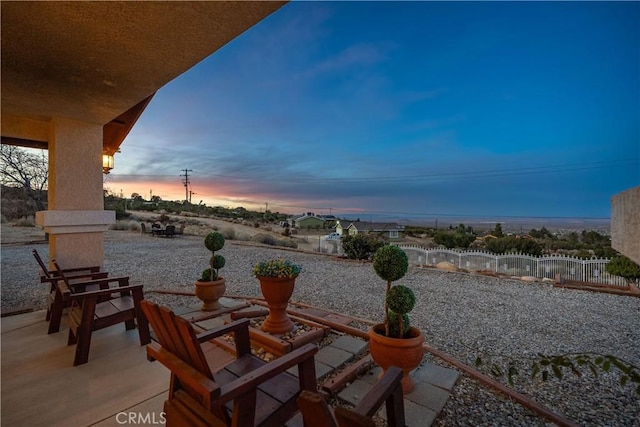 view of patio terrace at dusk