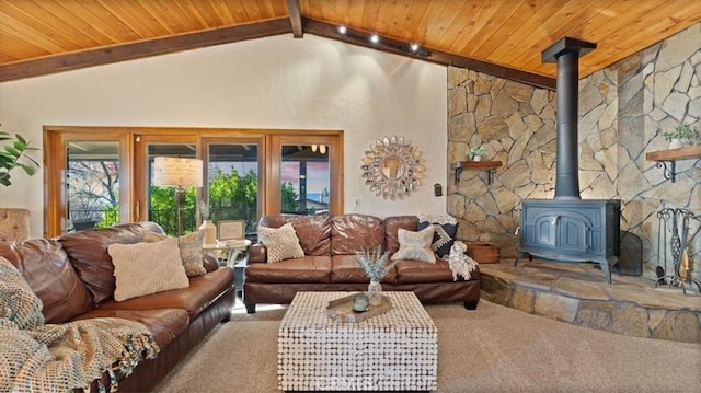 living room featuring high vaulted ceiling, beamed ceiling, carpet floors, and a wood stove