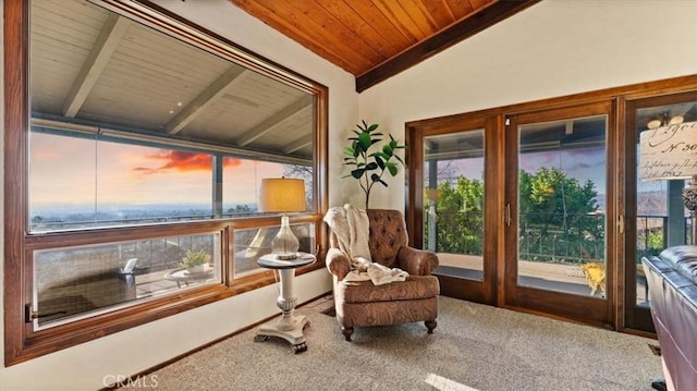 sunroom / solarium featuring vaulted ceiling and wood ceiling