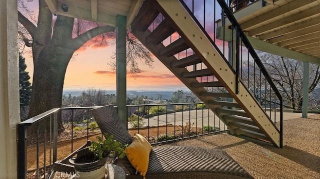 view of balcony at dusk