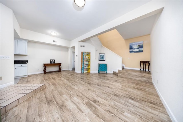 unfurnished living room with light wood-type flooring