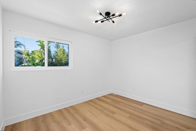 spare room featuring hardwood / wood-style floors