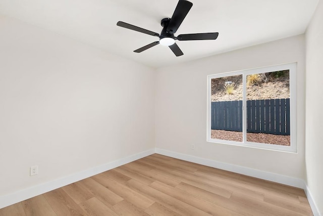 unfurnished room with light wood-type flooring and ceiling fan