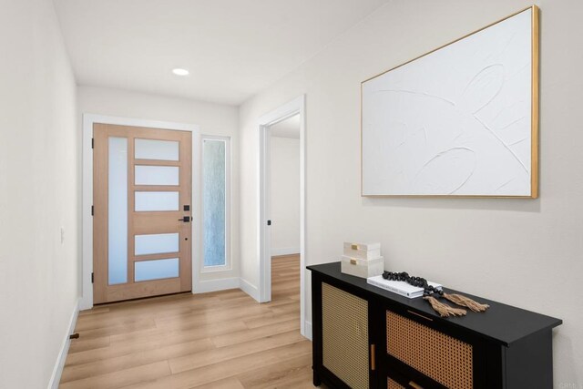 entryway with light hardwood / wood-style floors