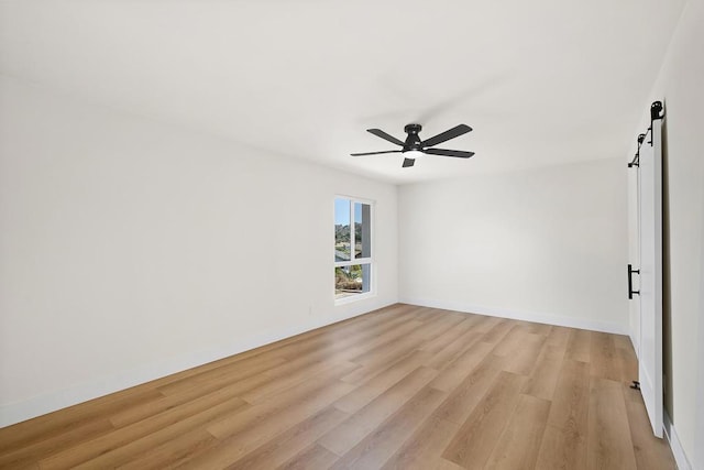 unfurnished room with ceiling fan and light hardwood / wood-style floors