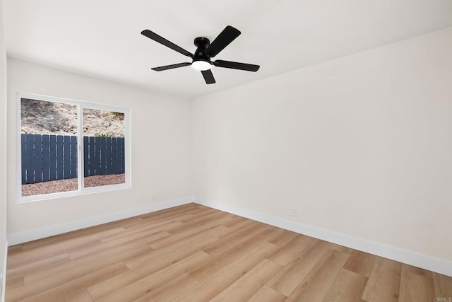 empty room with ceiling fan and wood-type flooring