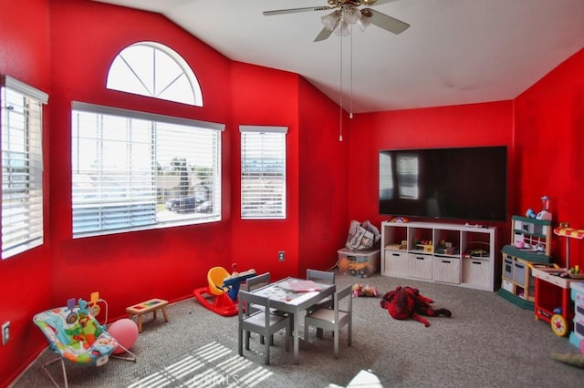 rec room featuring carpet, vaulted ceiling, and ceiling fan