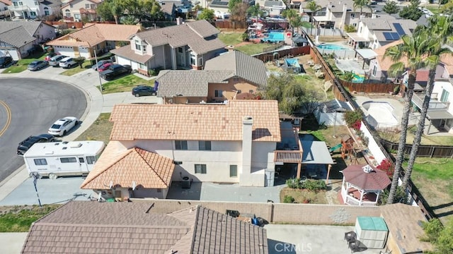 birds eye view of property with a residential view