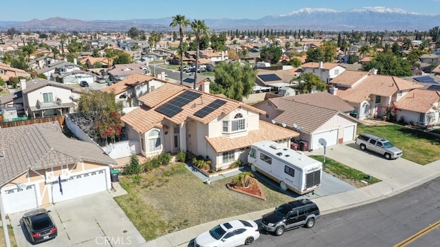 birds eye view of property with a residential view and a mountain view