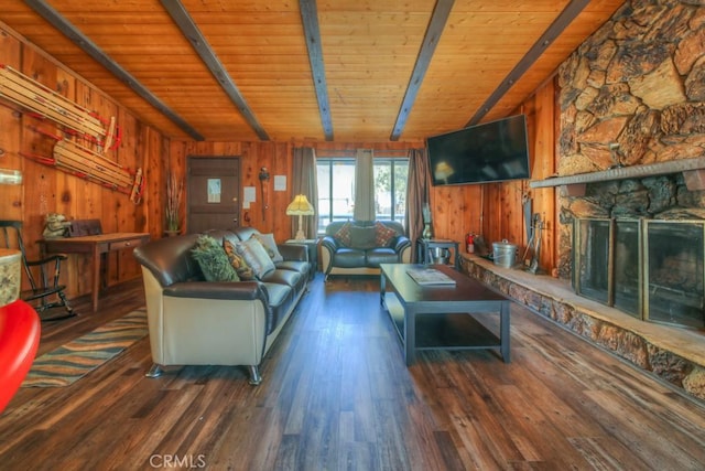 living room featuring wood ceiling and wood walls