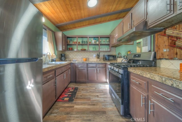 kitchen featuring dark hardwood / wood-style floors, lofted ceiling with beams, sink, appliances with stainless steel finishes, and wooden ceiling