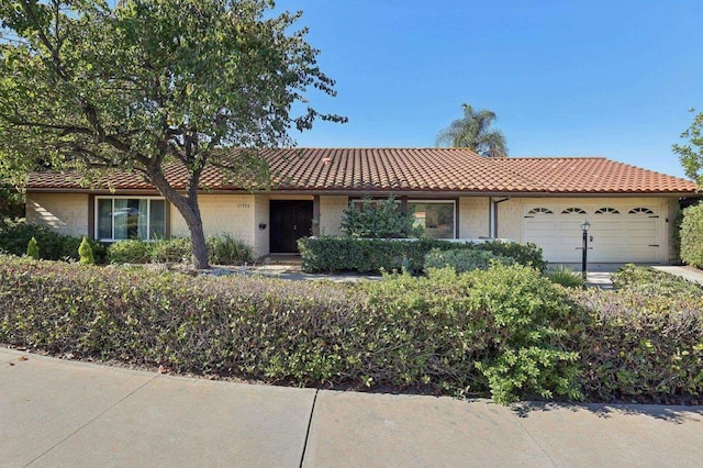 ranch-style house featuring a garage