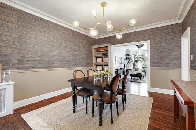 dining area featuring dark wood-type flooring, crown molding, and a chandelier