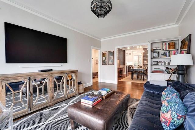 living room with ornamental molding and hardwood / wood-style floors