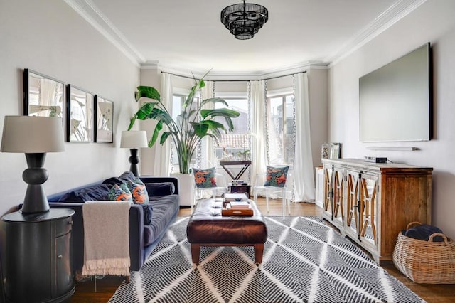 living room featuring wood-type flooring and crown molding