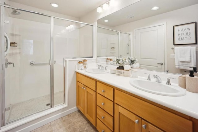 bathroom with vanity, tile patterned flooring, and walk in shower