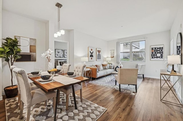 dining area with dark hardwood / wood-style floors