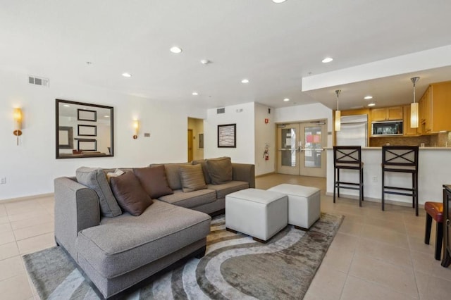 tiled living room with french doors