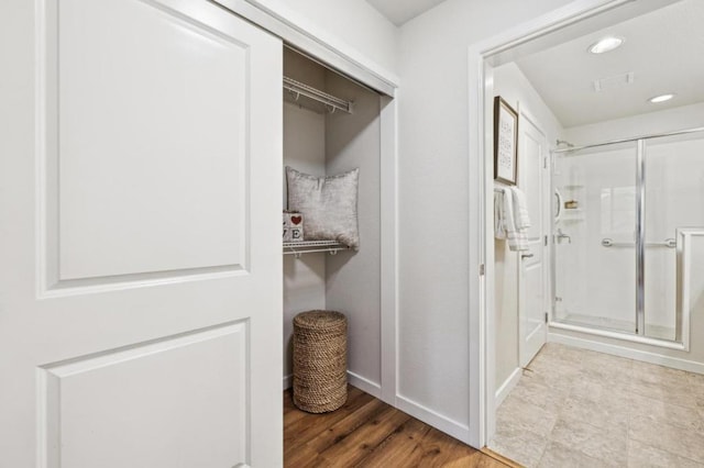 hall with light wood-type flooring