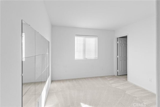 unfurnished bedroom with light carpet