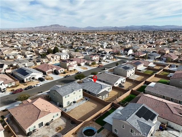 birds eye view of property with a mountain view