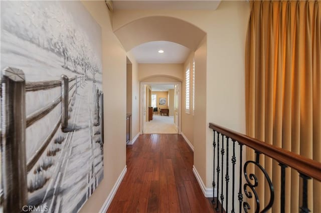 hall with dark wood-type flooring