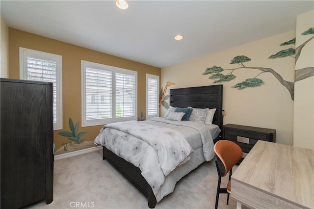 bedroom featuring light carpet