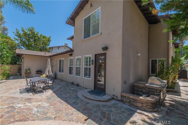 rear view of property with a patio