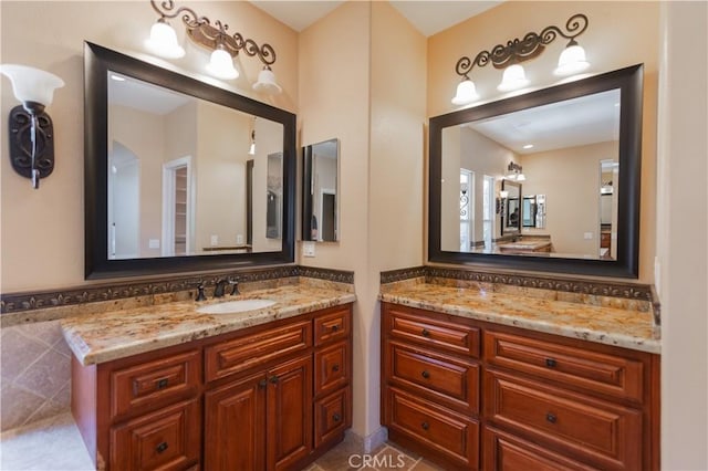 bathroom with tile patterned floors and vanity