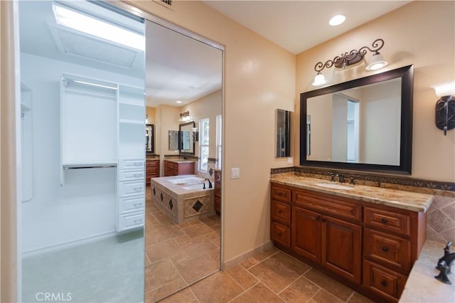 bathroom featuring a bath and vanity