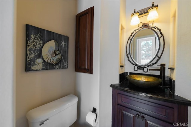 bathroom with toilet and vanity