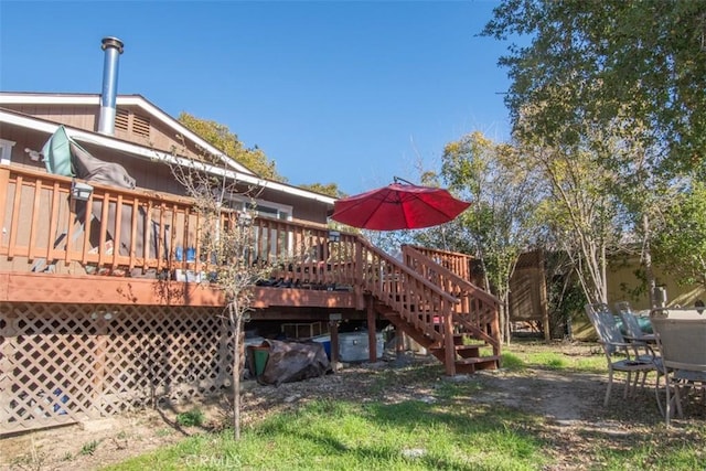 rear view of property with a deck