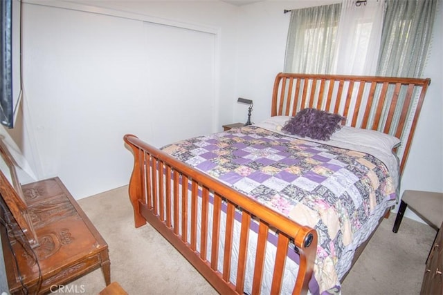 carpeted bedroom with a closet