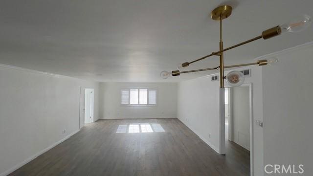 spare room with dark wood-type flooring