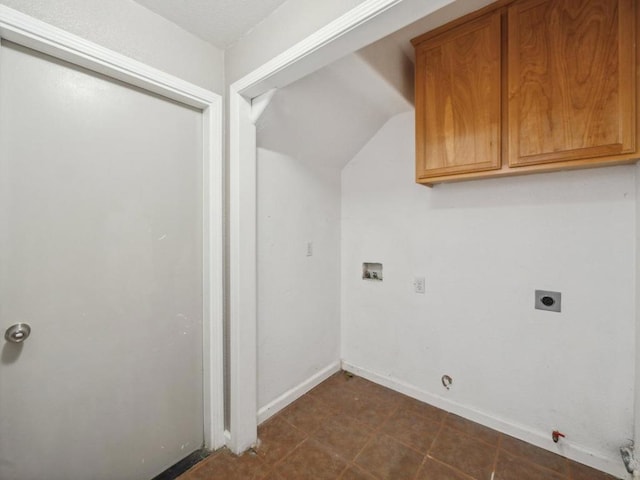 laundry room featuring electric dryer hookup, cabinets, hookup for a washing machine, and hookup for a gas dryer