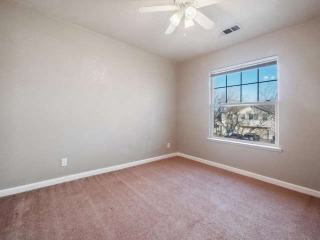 carpeted empty room featuring ceiling fan