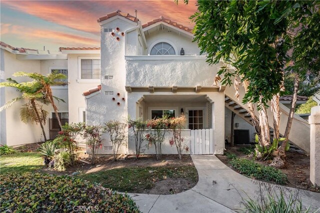 mediterranean / spanish-style house featuring a balcony and central AC