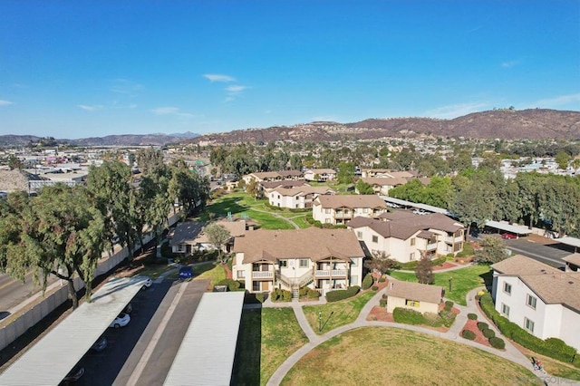 birds eye view of property with a mountain view