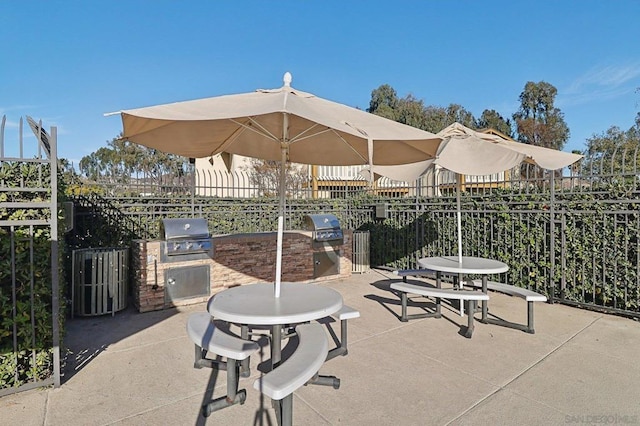 view of patio with exterior kitchen and grilling area