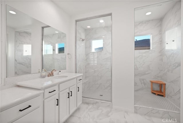 bathroom with vanity and tiled shower