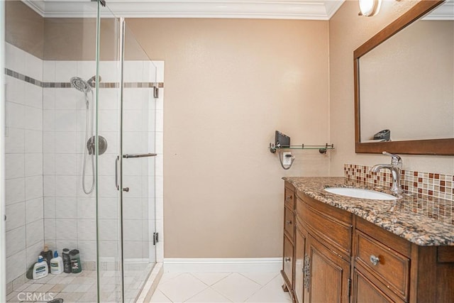 bathroom featuring backsplash, tile patterned flooring, an enclosed shower, crown molding, and vanity