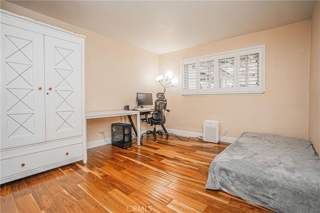 bedroom featuring hardwood / wood-style flooring