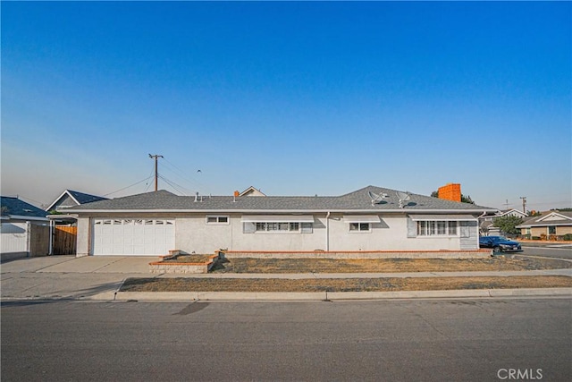 ranch-style home featuring a garage