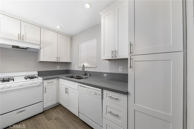 kitchen with light wood-type flooring, white cabinetry, sink, and white appliances