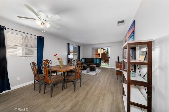 dining room featuring ceiling fan and wood-type flooring