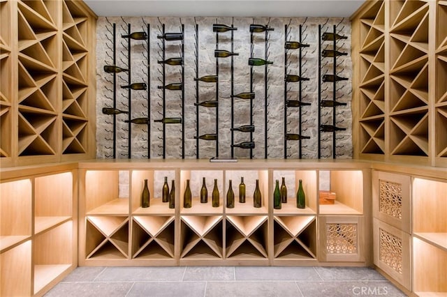 wine area with tile patterned flooring