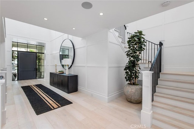 foyer entrance featuring light wood-type flooring