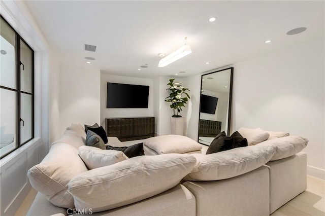 living room featuring a fireplace