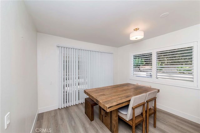 dining area featuring light wood-type flooring