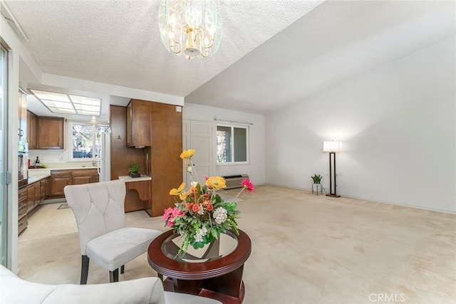 carpeted living room featuring a textured ceiling and an inviting chandelier